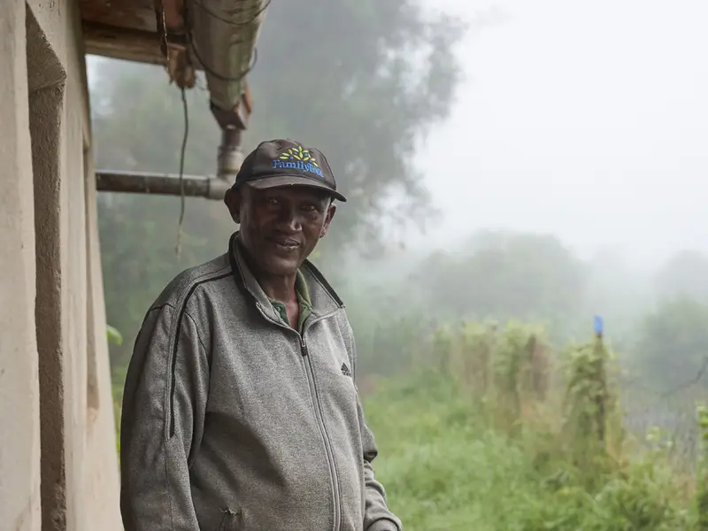 Smallholder partner farmer at his homestead